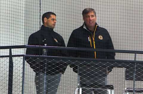 BOSTON – SEPTEMBER 24: Boston Bruins general manager Don Sweeney, left, chats with Bruins president Cam Neely as they watch the camp from the stands during training camp at Warrior Ice Arena in Boston on Sept. 24, 2016. (Photo by John Tlumacki/The Boston Globe via Getty Images)