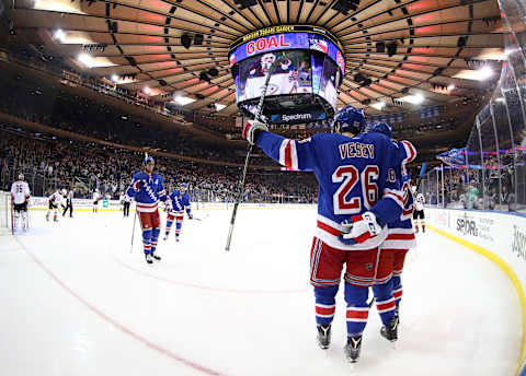 NEW YORK, NEW YORK – DECEMBER 19: The New York Rangers celebrate a goal by Paul Carey