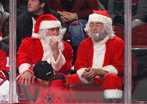 NEWARK, NJ – DECEMBER 23: Fans dressed as Santa Claus attend the game between the Carolina Hurricanes and the New Jersey Devils at the Prudential Center on December 23, 2014 in Newark, New Jersey. (Photo by Andy Marlin/NHLI via Getty Images)