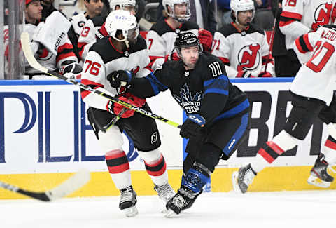 Mar 23, 2022; Toronto, Ontario, CAN; Toronto Maple Leafs forward Colin Blackwell (11) battles for position with New Jersey Devils defenseman P.K. Subban (76) in the first period at Scotiabank Arena. Mandatory Credit: Dan Hamilton-USA TODAY Sports