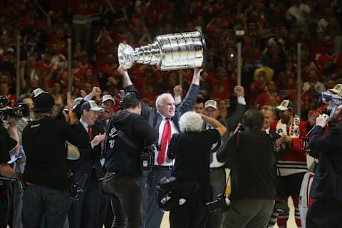 Chicago Blackhawks head coach Joel Quenneville celebrates with the Stanley Cup after the team defeated the Tampa Bay Lightning in Game 6 of the Stanley Cup Final on Monday, June 15, 2015, at the United Center in Chicago. (Brian Cassella/Chicago Tribune/TNS via Getty Images)