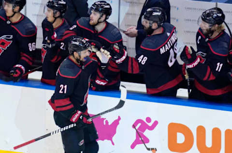 Aug 15, 2020; Toronto, Ontario, CAN; Carolina Hurricanes right wing Nino Niederreiter (21) is congratulated after scoring a goal against the Boston Bruins during the third period in game three of the first round of the 2020 Stanley Cup Playoffs at Scotiabank Arena. Mandatory Credit: John E. Sokolowski-USA TODAY Sports