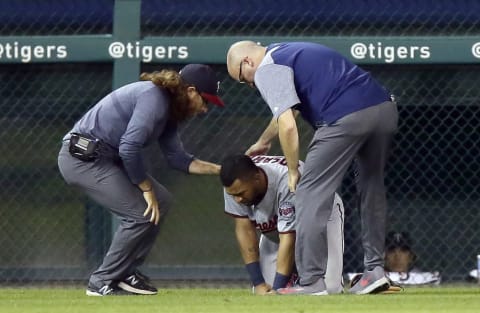 DETROIT, MI – SEPTEMBER 17: Eddie Rosario #20 of the Minnesota Twins is assisted by trainers after injuring his lower right leg while fielding a ball hit by Jim Adduci of the Detroit Tigers during the fourth inning at Comerica Park on September 17, 2018 in Detroit, Michigan. (Photo by Duane Burleson/Getty Images)