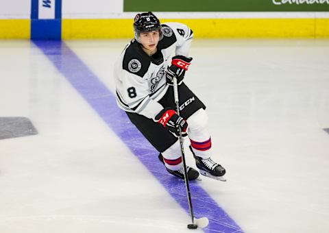 KITCHENER, ONTARIO – MARCH 23: Tristan Luneau #8 of Team White skates with the puck during morning skate prior to the 2022 CHL/NHL Top Prospects Game at Kitchener Memorial Auditorium on March 23, 2022 in Kitchener, Ontario. (Photo by Chris Tanouye/Getty Images)