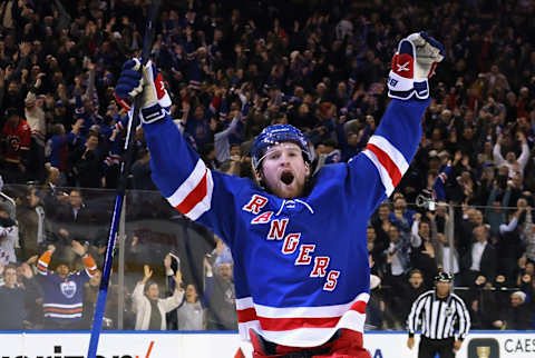 NEW YORK, NEW YORK – FEBRUARY 06: Alexis Lafreniere #13 of the New York Rangers celebrates his game-winning overtime goal against the Calgary Flames at Madison Square Garden on February 06, 2023, in New York City. The Rangers defeated the Flames 5-4 in overtime. (Photo by Bruce Bennett/Getty Images)