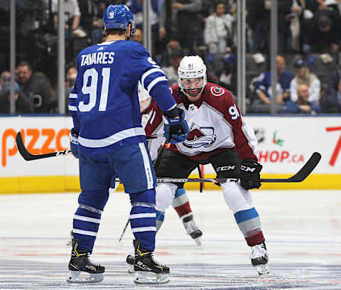 TORONTO, ON – DECEMBER 4: Nazem Kadri #91 of the Colorado Avalanche gets set to take the opening faceoff against John Tavares #91 of the Toronto Maple Leafs . (Photo by Claus Andersen/Getty Images)