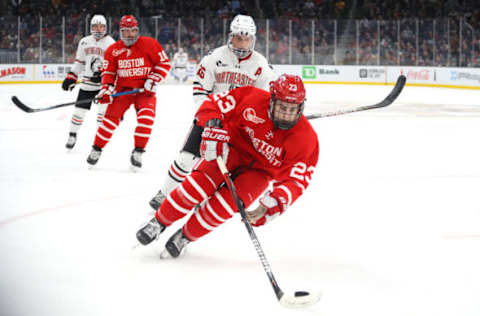 BOSTON, MASSACHUSETTS – FEBRUARY 10: Domenick Fensore # of the Boston University Terriers skates past Biagio Lerario #26 of the Northeastern Huskies during the second period of the 2020 Beanpot Tournament Championship game between the Northeastern Huskies and the Boston University Terriers at TD Garden on February 10, 2020 in Boston, Massachusetts. (Photo by Maddie Meyer/Getty Images)