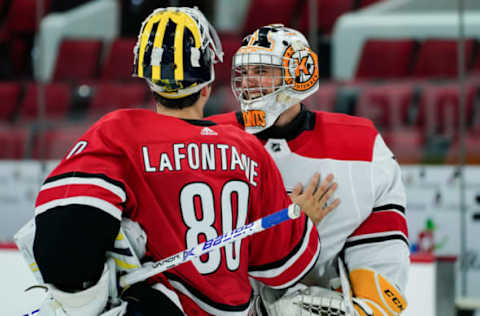 RALEIGH, NC – JUNE 30: Carolina Hurricanes Jack LaFontaine (80) and Carolina Hurricanes Jeremy Helvig (50) meet at center ice after the Canes Prospect Game at the PNC Arena in Raleigh, NC on June 30, 2018. (Photo by Greg Thompson/Icon Sportswire via Getty Images)