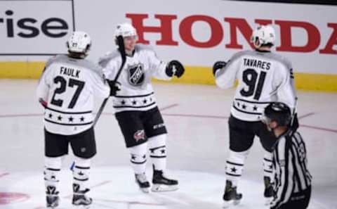 Jan 29, 2017; Los Angeles, CA, USA; Metropolitan Division forward Cam Atkinson (13) of the Columbus Blue Jackets celebrates with forward John Tavares (91) of the New York Islanders and defenseman Justin Faulk (27) of the Carolina Hurricanes after a goal against the Pacific Division during the 2017 NHL All Star Game at Staples Center. Mandatory Credit: Kelvin Kuo-USA TODAY Sports