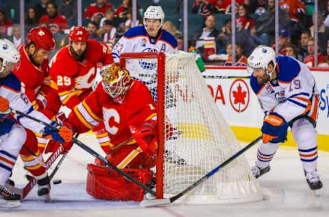 Oct 14, 2016; Calgary, Alberta, CAN; Calgary Flames goalie Brian Elliott (1) makes a save as Edmonton Oilers left wing Patrick Maroon (19) tries to score during the second period at Scotiabank Saddledome. Mandatory Credit: Sergei Belski-USA TODAY Sports