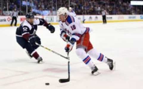 Dec 31, 2016; Denver, CO, USA; New York Rangers left wing J.T. Miller (10) drives to the net to score a goal in the third period against the Colorado Avalanche at Pepsi Center. The Rangers defeated the Avalanche 6-2. Mandatory Credit: Ron Chenoy-USA TODAY Sports