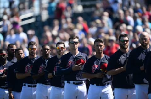 Mar 11, 2017; Goodyear, AZ, USA; Cleveland Indians players look on during the national anthem prior to facing the Kansas City Royals at Goodyear Ballpark. Mandatory Credit: Joe Camporeale-USA TODAY Sports