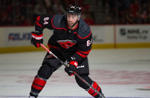 DETROIT, MI – OCTOBER 22: Clark Bishop #64 of the Carolina Hurricanes shoots the puck against the Detroit Red Wings during an NHL game at Little Caesars Arena on October 22, 2018 in Detroit, Michigan. The Hurricanes defeated the Wings 3-1. (Photo by Dave Reginek/NHLI via Getty Images)