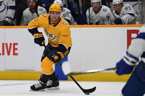 Sep 27, 2023; Nashville, Tennessee, USA; Nashville Predators defenseman Marc Del Gaizo (7) handles the puck near the blue line during the first period against the Tampa Bay Lightning at Bridgestone Arena. Mandatory Credit: Christopher Hanewinckel-USA TODAY Sports