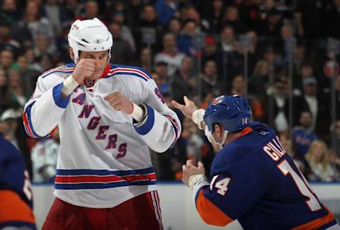 Derek Boogaard #94 of the New York Rangers fights with Trevor Gillies #14 of the New York Islanders (Photo by Bruce Bennett/Getty Images)