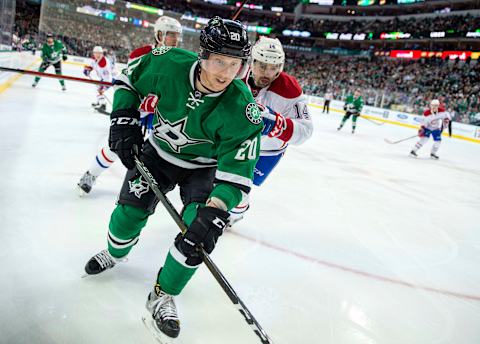 Jan 4, 2017; Dallas, TX, USA; Montreal Canadiens center Tomas Plekanec (14) and Dallas Stars center Cody Eakin (20) chase the puck during the third period at the American Airlines Center. The Canadiens defeat the Stars 4-3 in overtime. Mandatory Credit: Jerome Miron-USA TODAY Sports