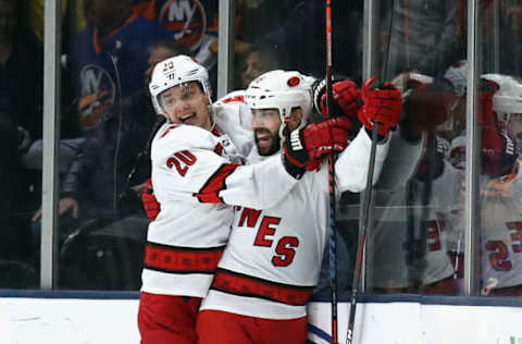 UNIONDALE, NEW YORK – MARCH 07: Sebastian Aho #20 and Vincent Trocheck #16 of the Carolina Hurricanes celebrate their 3-2 overtime victory over the New York Islanders at NYCB Live’s Nassau Coliseum on March 07, 2020 in Uniondale, New York. (Photo by Bruce Bennett/Getty Images)