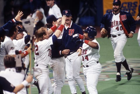 Kirby Puckett celebrates walk-off HR in Game 6 of the 1991 World Series. (Photo by Focus on Sport/Getty Images)