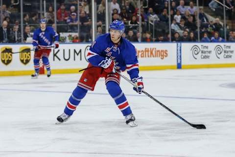 Dec 6, 2015; New York, NY, USA; New York Rangers center Oscar Lindberg (24) shoots the puck against the Ottawa Senators at Madison Square Garden. Mandatory Credit: Vincent Carchietta-USA TODAY Sports