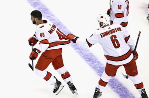 Jordan Martinook #48 and Joel Edmundson #6 of the Carolina Hurricanes (Photo by Elsa/Getty Images)