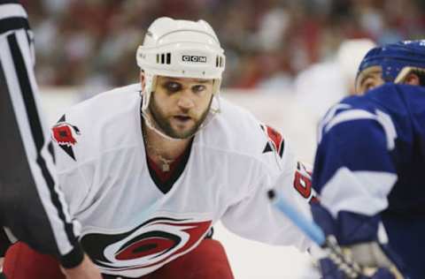 RALEIGH, NC – MAY 25: Center Jeff O’Neill #92 of the Carolina Hurricanes takes the face off during game five of the Eastern Conference finals in the Stanley Cup playoffs against the Toronto Maple Leafs at the Raleigh Sports Arena in Raleigh, North Carolina on May 25, 2002. The Maple Leafs won 1-0. (Photo by Doug Pensinger/Getty Images/NHLI)