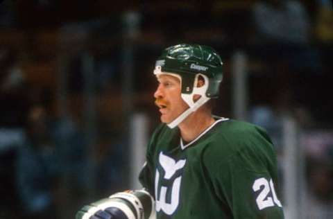 EAST RUTHERFORD, NJ – CIRCA 1988: John Anderson #20 of the Hartford Whalers skates against the New Jersey Devils during an NHL Hockey game circa 1988 at the Brendan Byrne Arena in East Rutherford, New Jersey. Anderson’s playing career went from 1977-94. (Photo by Focus on Sport/Getty Images)