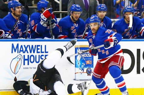 Apr 18, 2015; New York, NY, USA; Pittsburgh Penguins right wing Beau Bennett (19) is checked to the ice by New York Rangers defenseman Dan Boyle (22) during game 2 of the 2015 NHL Stanley Cup Playoffs Round 1 at Madison Square Garden. The Penguins defeated the Rangers 4-3. Mandatory Credit: Andy Marlin-USA TODAY Sports