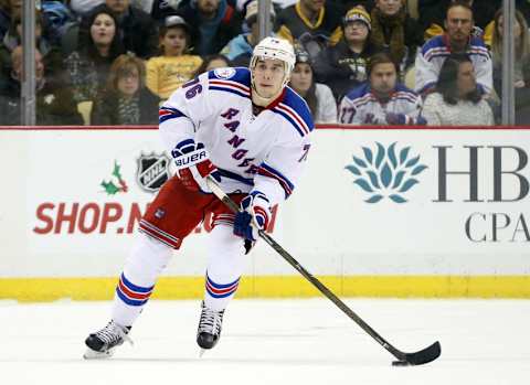 Dec 20, 2016; Pittsburgh, PA, USA; New York Rangers defenseman Brady Skjei (76) moves the puck against the Pittsburgh Penguins during the third period at the PPG PAINTS Arena. The Penguins won 7-2.Mandatory Credit: Charles LeClaire-USA TODAY Sports