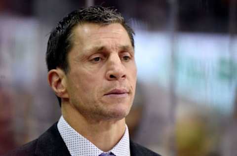 Rod Brind’Amour of the Carolina Hurricanes is behind the bench for a game against the Pittsburgh Penguins. (Photo by Grant Halverson/Getty Images)