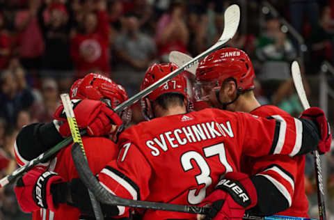 RALEIGH, NC – SEPTEMBER 29: Carolina Hurricanes right wing Andrei Svechnikov (37) celebrates with teammates during an NHL Preseason game between the Washington Capitals and the Carolina Hurricanes on September 29, 2019 at the PNC Arena in Raleigh, NC. (Photo by Greg Thompson/Icon Sportswire via Getty Images)