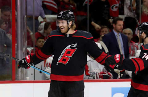 RALEIGH, NC – APRIL 15: Dougie Hamilton #19 of the Carolina Hurricanes scores a goal and celebrates in Game Three of the Eastern Conference First Round against the Washington Capitals during the 2019 NHL Stanley Cup Playoffs on April 15, 2019 at PNC Arena in Raleigh, North Carolina. (Photo by Gregg Forwerck/NHLI via Getty Images)