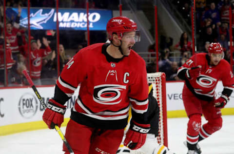 RALEIGH, NC – MARCH 19: Justin Williams #14 of the Carolina Hurricanes scores the game-tying goal in regulation during an NHL game against the Pittsburgh Penguins on March 19, 2019 at PNC Arena in Raleigh, North Carolina. (Photo by Gregg Forwerck/NHLI via Getty Images)