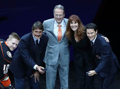 ANAHEIM, CA – NOVEMBER 19: (L-R) Corey Perry #10 of the Anaheim Ducks, former Ducks player Teemu Selanne, Ducks owners Henry and Susan Samueli and former Ducks player Paul Kariya pose for the ceremonial puck drop during the pre-game ceremony prior to the NHL game at Honda Center on November 19, 2017, in Anaheim, California. (Photo by Victor Decolongon/Getty Images)