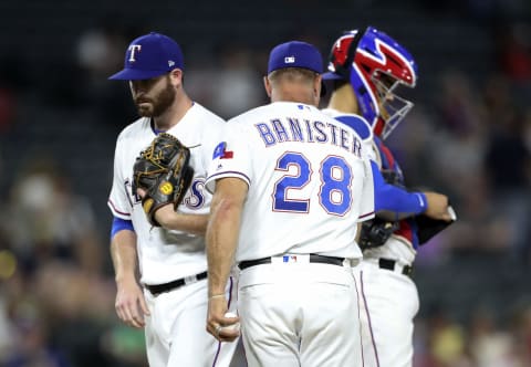 Aug 31, 2018; Arlington, TX, USA; Texas Rangers starting pitcher Drew Hutchison (48) is removed by manager Jeff Banister (28) during the fifth inning against the Minnesota Twins at Globe Life Park in Arlington. Mandatory Credit: Kevin Jairaj-USA TODAY Sports