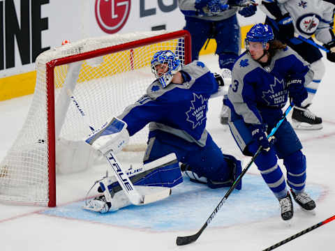 Mar 9, 2021; Toronto, Ontario, CAN; A shot by Winnipeg Jets forward Kyle Connor (not pictured) scores on Toronto Maple Leafs goaltender Frederik Andersen (31) as Toronto Maple Leafs defenseman Justin Holl (3) Mandatory Credit: John E. Sokolowski-USA TODAY Sports