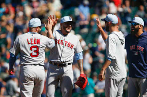 SEATTLE, WA – JUNE 17: Hector Velazquez #76 of the Boston Red Sox gets a high five from Sandy Leon #3 after closing out the game against the Seattle Mariners at Safeco Field on June 17, 2018 in Seattle, Washington. The Boston Red Sox beat the Seattle Mariners 9-3. (Photo by Lindsey Wasson/Getty Images)