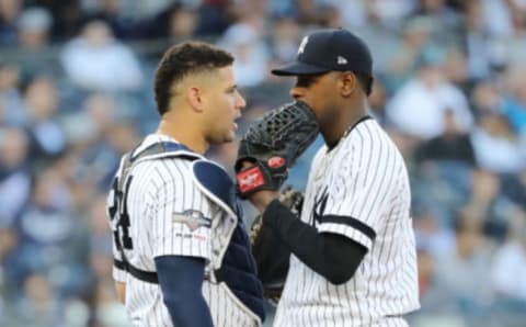 Luis Severino talks with Gary Sanchez. (Photo by Elsa/Getty Images)