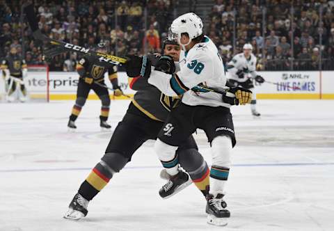 LAS VEGAS, NEVADA – OCTOBER 02: Ryan Reaves #75 of the Vegas Golden Knights hits Mario Ferraro #38 of the San Jose Sharks during the first period at T-Mobile Arena on October 02, 2019 in Las Vegas, Nevada. (Photo by David Becker/NHLI via Getty Images)