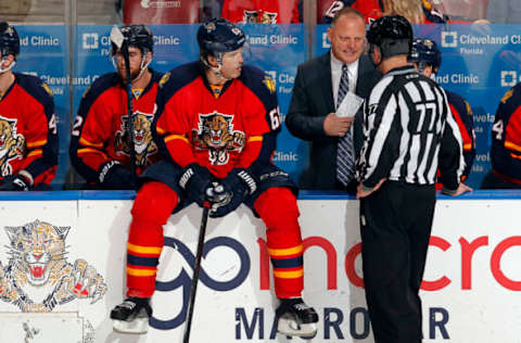 SUNRISE, FL – MARCH 7: Florida Panthers Head Coach Gerard Gallant chats with NHL Linesmen Tim Nowak