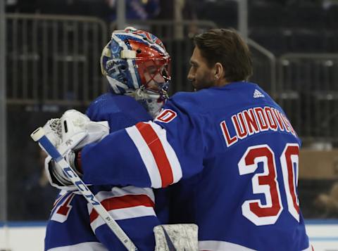 NEW YORK, NEW YORK – JANUARY 07: Igor Shesterkin #31 of the New York Rangers (L) who was playing in his first NHL game records a 5-3 victory over the Colorado Avalanche and is embraced by Henrik Lundqvist #30 (R) at Madison Square Garden on January 07, 2020 in New York City. (Photo by Bruce Bennett/Getty Images)