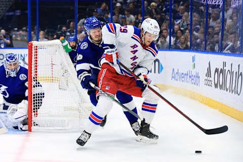 TAMPA, FLORIDA – JUNE 11: Dryden Hunt #29 of the New York Rangers skates with the puck against Mikhail Sergachev #98 of the Tampa Bay Lightning during the first period in Game Six of the Eastern Conference Final of the 2022 Stanley Cup Playoffs at Amalie Arena on June 11, 2022, in Tampa, Florida. (Photo by Andy Lyons/Getty Images)