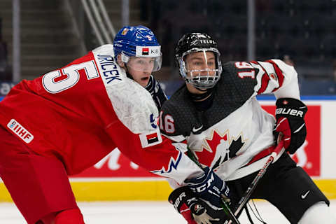 Connor Bedard #16 battles against David Jiricek #5 (Photo by Codie McLachlan/Getty Images)