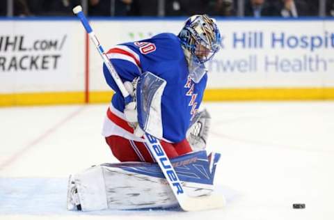 Apr 7, 2016; New York, NY, USA; New York Rangers goalie Henrik Lundqvist (30) makes a save against the New York Islanders during the first period at Madison Square Garden. Mandatory Credit: Brad Penner-USA TODAY Sports