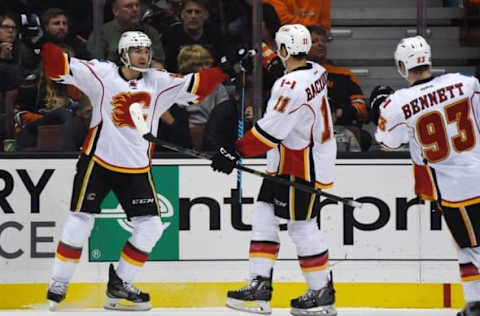 Nov 24, 2015; Anaheim, CA, USA;Calgary Flames right wing Michael Frolik (67) celebrates with center Mikael Backlund (11) and center Sam Bennett (93) after scoring a goal in the second period against the Anaheim Ducks at Honda Center. Mandatory Credit: Kirby Lee-USA TODAY Sports