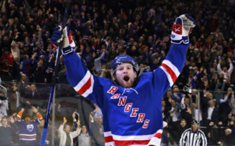 NEW YORK, NEW YORK – FEBRUARY 06: Alexis Lafreniere #13 of the New York Rangers celebrates his game-winning overtime goal against the Calgary Flames at Madison Square Garden on February 06, 2023, in New York City. The Rangers defeated the Flames 5-4 in overtime. (Photo by Bruce Bennett/Getty Images)