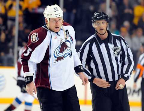 Jan 27, 2015; Nashville, TN, USA; Colorado Avalanche left winger Cody McLeod (55) skates off the ice with a bloody nose after a fight during the first period against the Nashville Predators at Bridgestone Arena. Mandatory Credit: Christopher Hanewinckel-USA TODAY Sports