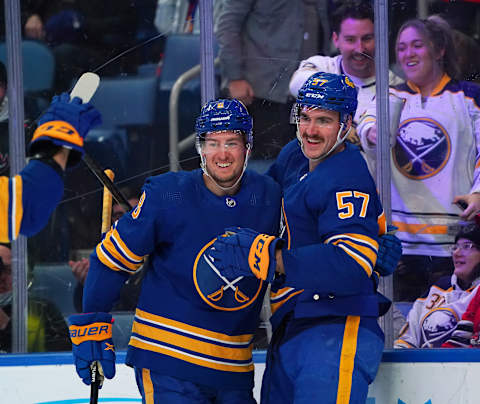 BUFFALO, NY – NOVEMBER 29: Brett Murray #57 of the Buffalo Sabres celebrates after scoring his first NHL goal with Robert Hagg #8 during the second period against the Seattle Kraken at KeyBank Center on November 29, 2021 in Buffalo, New York. (Photo by Kevin Hoffman/Getty Images)