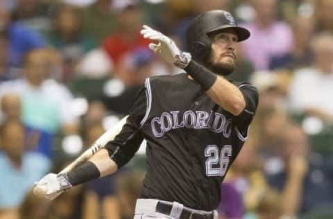 Aug 23, 2016; Milwaukee, WI, USA; Colorado Rockies left fielder David Dahl (26) singles during the third inning against the Milwaukee Brewers at Miller Park. Mandatory Credit: Jeff Hanisch-USA TODAY Sports