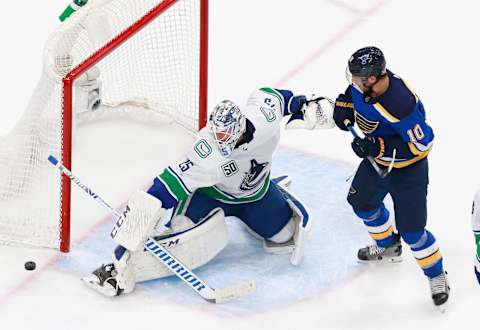 EDMONTON, ALBERTA – AUGUST 19: Jacob Markstrom #25 of the Vancouver Canucks makes a third period save as Brayden Schenn #10 of the St. Louis Blues looks for the rebound in Game Five of the Western Conference First Round during the 2020 NHL Stanley Cup Playoffs at Rogers Place on August 19, 2020 in Edmonton, Alberta, Canada. (Photo by Jeff Vinnick/Getty Images)