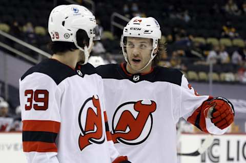 New Jersey Devils right wing Nicholas Merkley and defenseman Ty Smith: (Charles LeClaire-USA TODAY Sports)